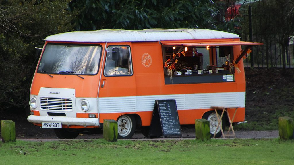 Restored vintage catering van with painted signwriting on the side
