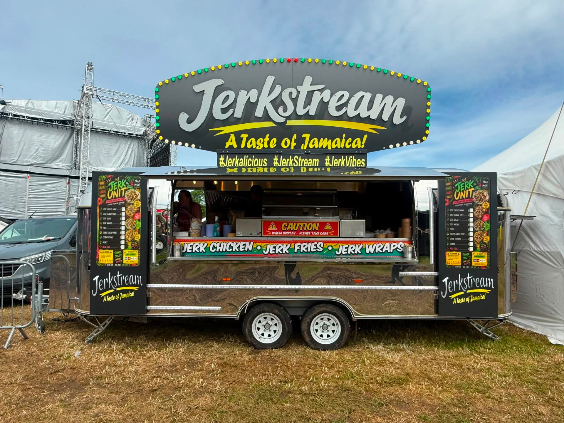 Jerkstream Jamaican food trailer with large illuminated top sign, branded side panels and serving hatch
